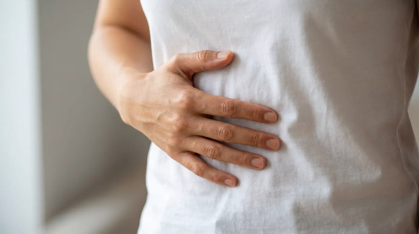 Medical illustration of the stomach and vagus nerve in functional dyspepsia showing impaired gastric accommodation and visceral hypersensitivity